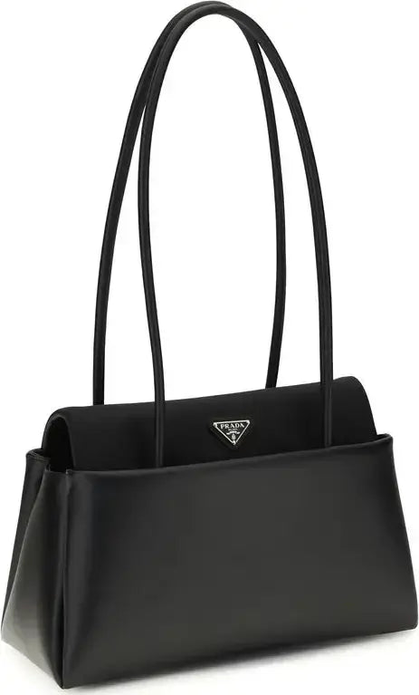 Black handbag with a visible brand logo on a white background