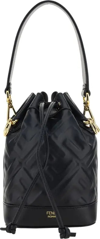 Black quilted handbag with gold accents on a white background