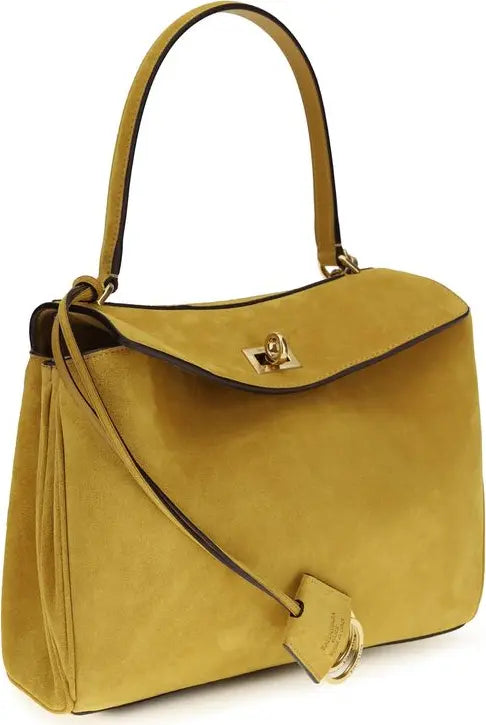 Yellow handbag with a gold clasp on a white background
