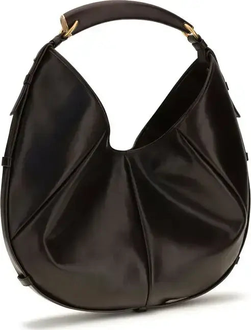 Black handbag with gold hardware on a white background