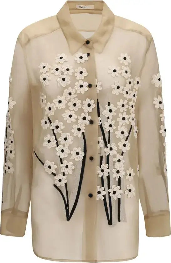 Beige blouse with floral embroidery on a white background