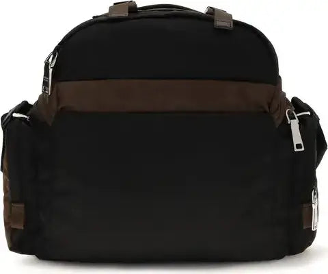 Black backpack with brown accents on a white background