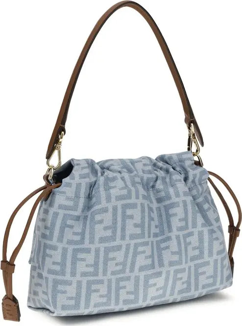 Blue handbag with brown straps on a white background