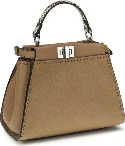 Beige handbag with a silver clasp on a white background