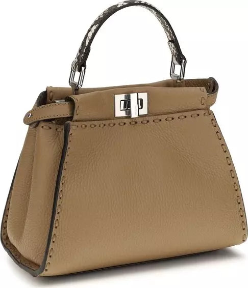 Beige handbag with a silver clasp on a white background