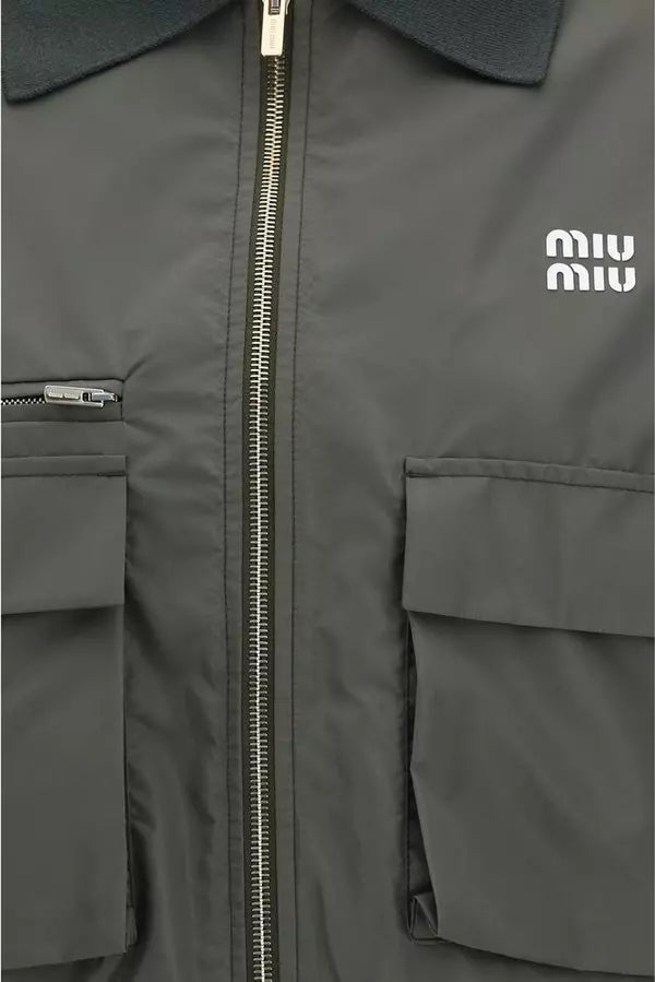 Gray jacket with a zipper and Miu Miu logo on a gray background