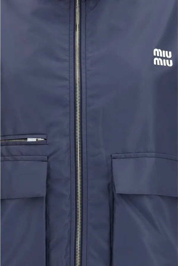 Navy blue jacket with a zipper and two front pockets, featuring the Miu Miu logo.