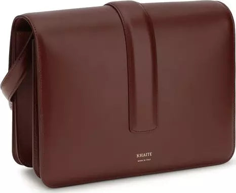 Brown leather bag with 'Khaite' branding on a white background
