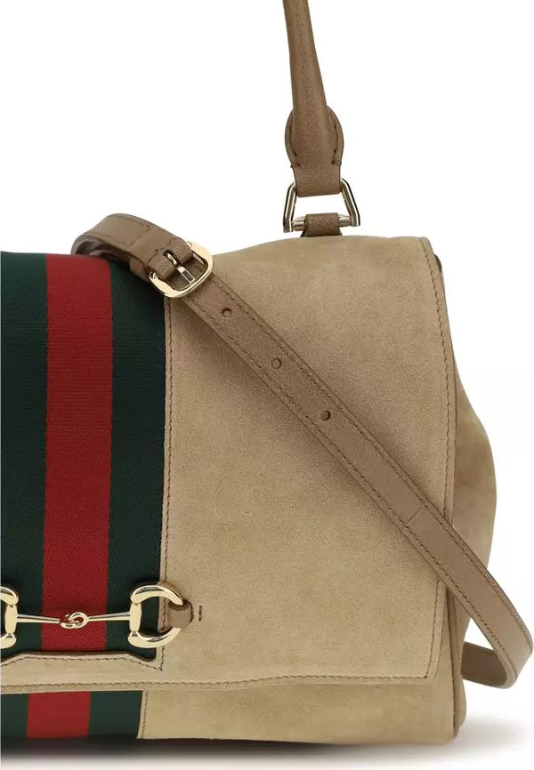 Beige handbag with a red and green striped detail on a white background
