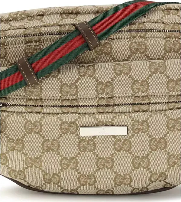 Beige patterned bag with a red and green strap on a white background