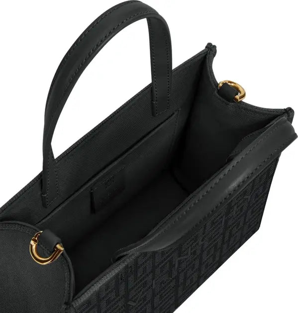 Black handbag with gold accents on a white background