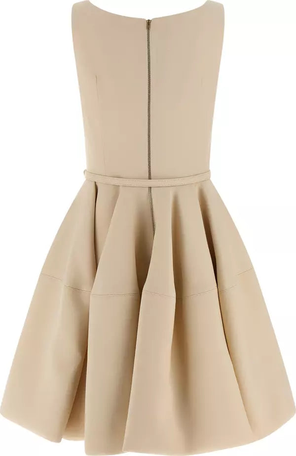 Beige dress with a fitted bodice and flared skirt on a white background