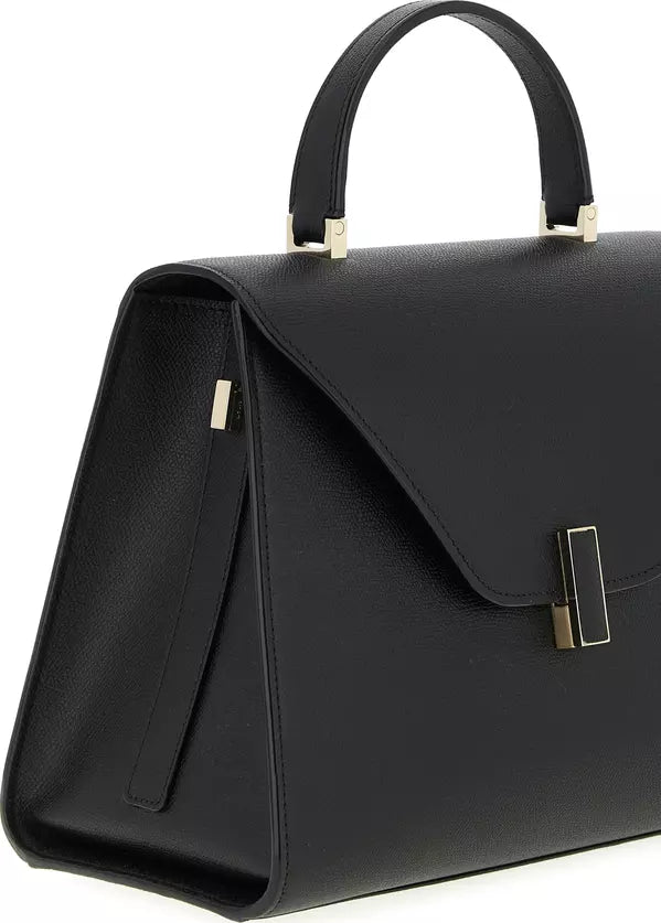 Black handbag with gold accents on a white background
