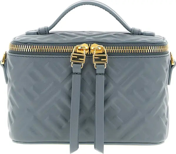 Gray quilted handbag with gold zipper and straps on a white background