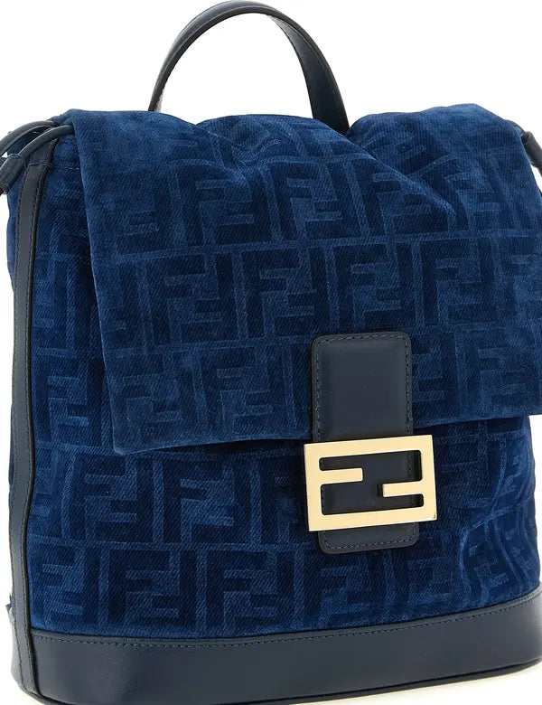 Blue velvet bag with gold logo on a white background