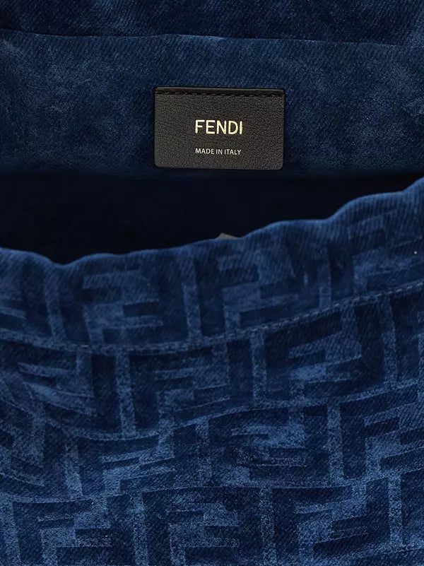 Close-up of a blue textured fabric with Fendi logo and 'Made in Italy' text.
