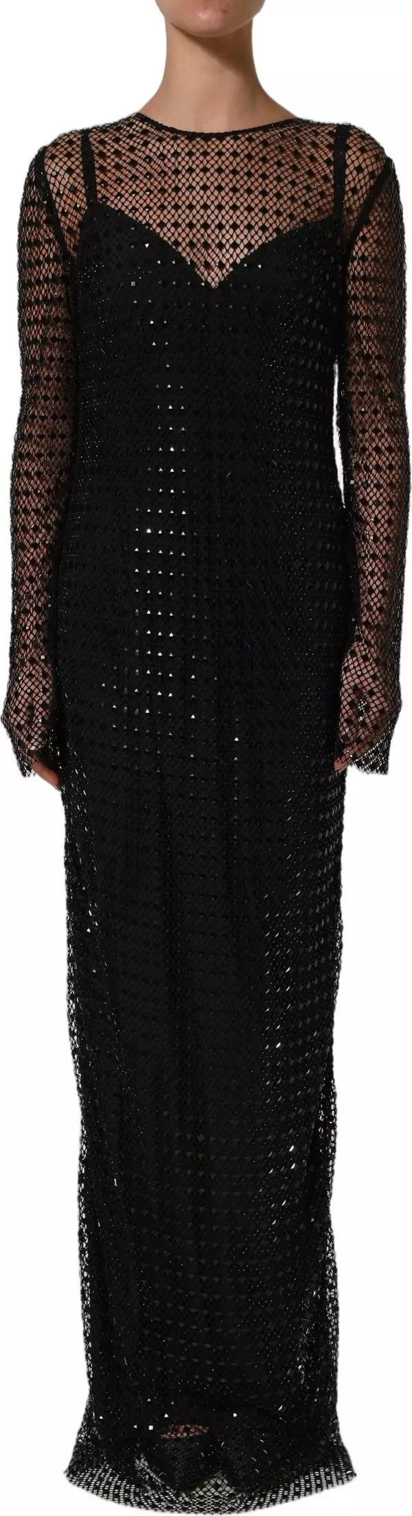 A black long-sleeve maxi dress with a sheer mesh overlay and a textured crochet or lace pattern, shown on a model against a white background.