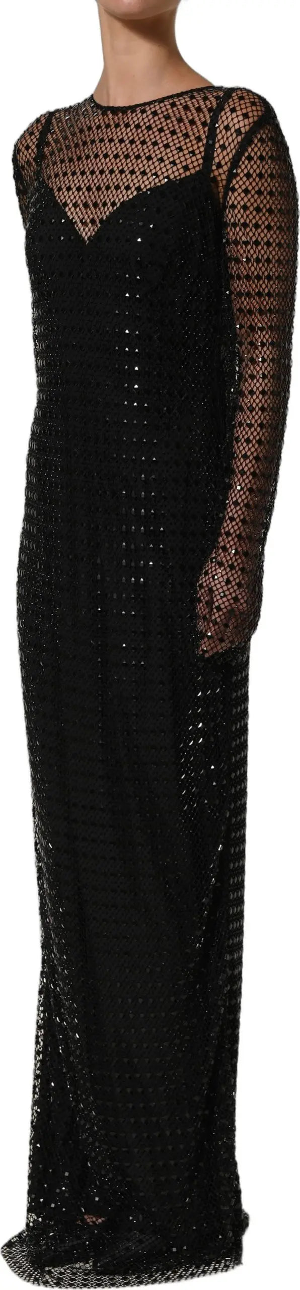 A black long-sleeve maxi dress with a sheer mesh overlay and sequined pattern, shown on a model against a white background.