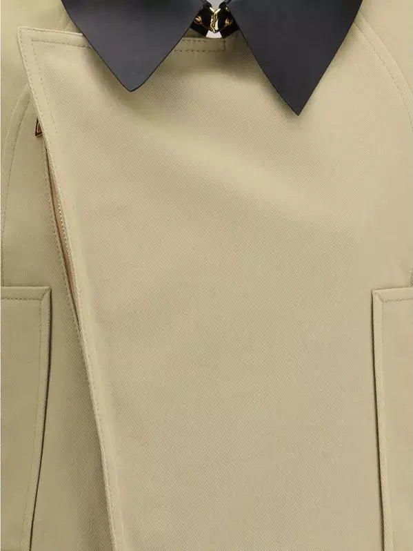 Close-up of a beige trench coat with a black collar