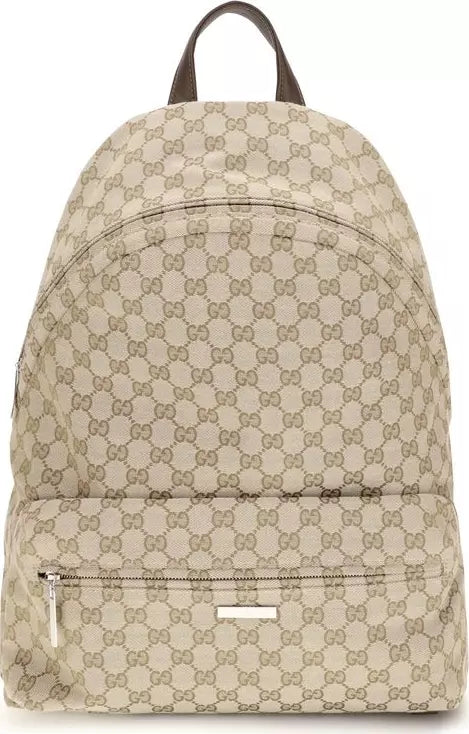 A beige and brown GG Supreme canvas backpack with a top handle, front zippered pocket, and silver-tone hardware, shown against a plain white background.