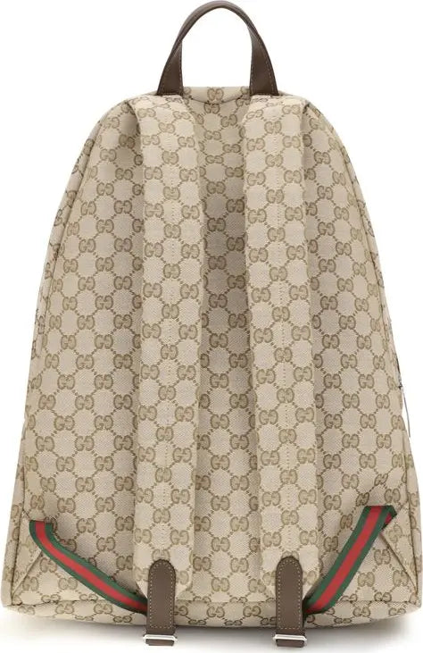 Gucci GG Supreme canvas backpack in beige with brown leather trim, featuring the iconic GG monogram pattern and green and red web stripe details.
