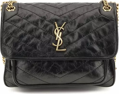 A black quilted leather shoulder bag with a prominent gold-tone YSL monogram logo on the front flap, set against a plain white background.