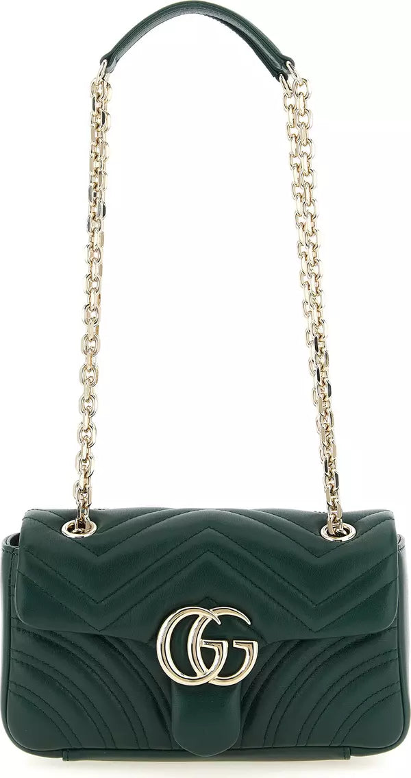 A dark green quilted leather shoulder bag with a silver-tone interlocking G logo on the front, a matching green leather top handle, and a silver-tone chain strap, shown against a plain white background.