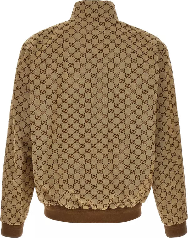 A tan and brown GG Supreme patterned jacket shown from the back, featuring a high collar, ribbed cuffs, and a ribbed hem.