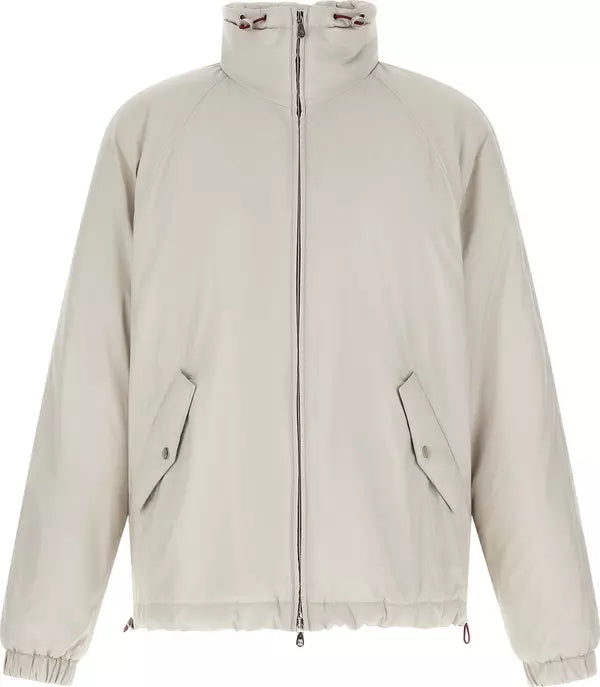 A light beige zip-up jacket with a high stand-up collar, long sleeves, and two angled front flap pockets, shown against a plain white background.