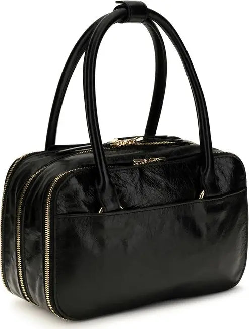 A black textured leather handbag with dual top handles, gold-tone zippers, and a front zippered pocket, shown on a plain white background.