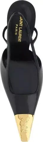 A black leather pointed-toe slingback pump by Saint Laurent Paris, featuring a metallic gold pointed toe cap with an embossed horse motif.