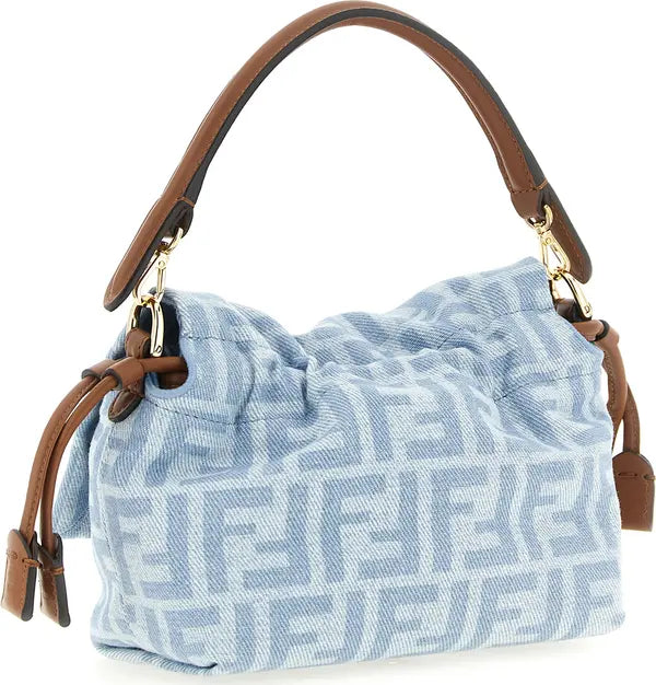 A light blue and white patterned Fendi handbag with brown leather handles and gold-tone hardware, shown against a plain white background.