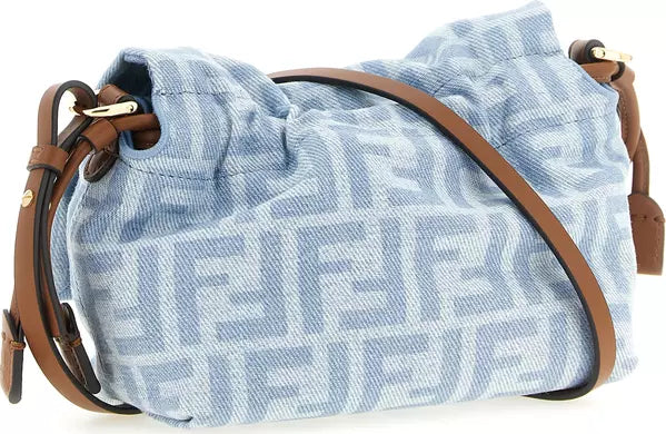 A light blue and white monogram canvas shoulder bag with brown leather straps and gold-tone hardware, shown against a plain white background.