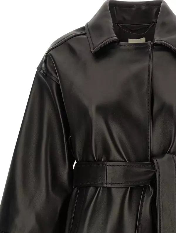Close-up of a black leather trench coat with a collar, belted waist, and shoulder epaulets on a white background.