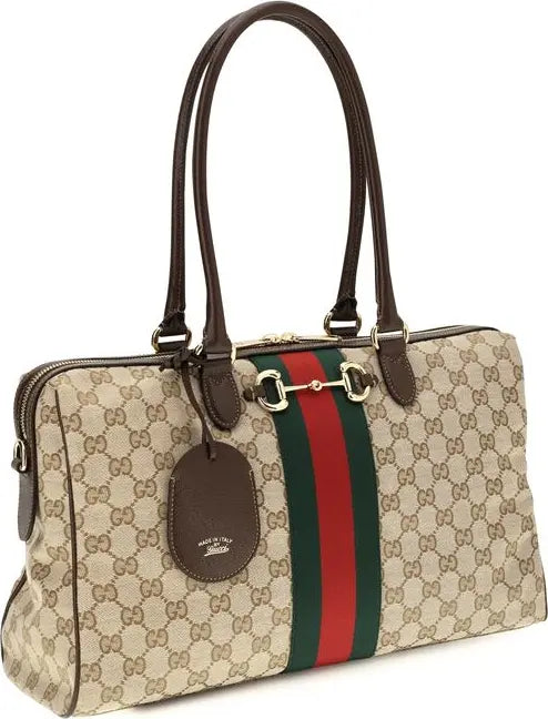 Gucci GG Supreme canvas handbag with brown leather handles, a green and red web stripe, and a horsebit detail on the front, shown on a white background.