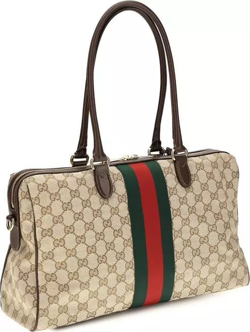 Gucci GG Supreme canvas handbag with brown leather handles and trim, featuring the signature green and red web stripe down the center.