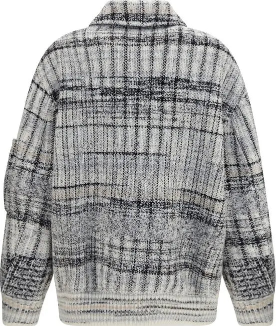 A textured knit cardigan with a high collar, featuring a black and white plaid pattern, shown from the back on a white background.
