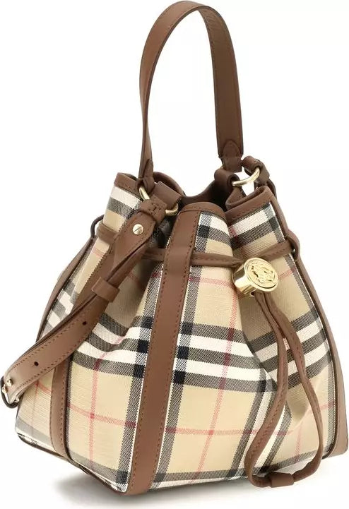 A classic plaid bucket bag in beige, brown, and black with tan leather trim and gold-tone hardware, shown on a plain white background.