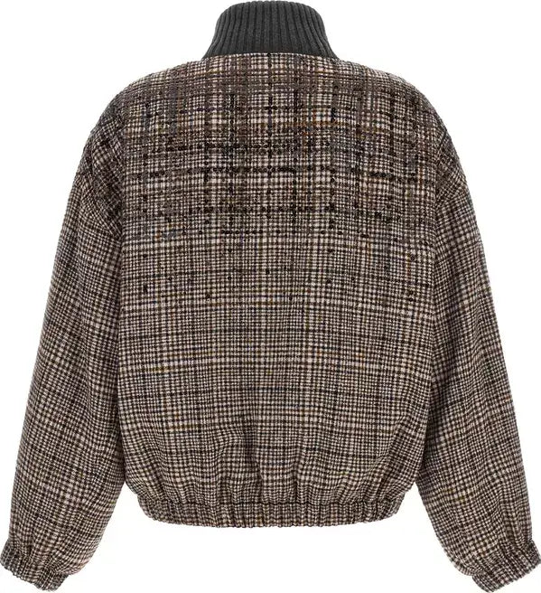 A cropped, long-sleeve tweed jacket with a dark ribbed turtleneck collar, shown from the back. The jacket features a brown, beige, and black plaid tweed pattern.