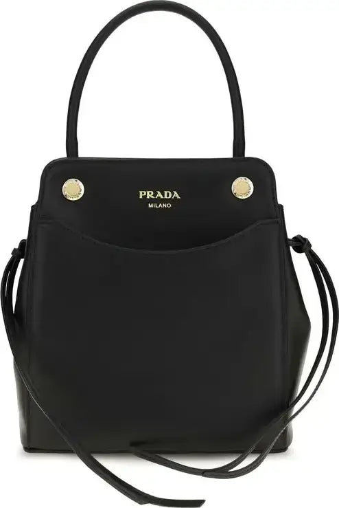 A black leather Prada Milano handbag with a top handle, gold-tone hardware, and a front pocket featuring the gold Prada logo.