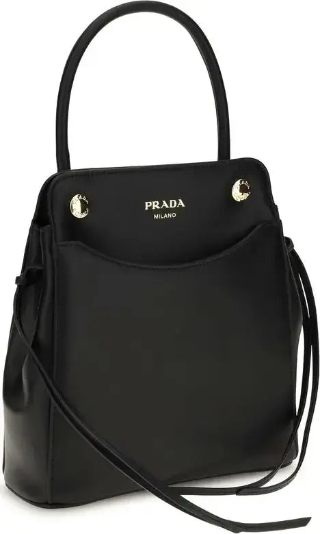 A black leather Prada handbag with a top handle, a front pocket featuring gold-tone hardware and the &