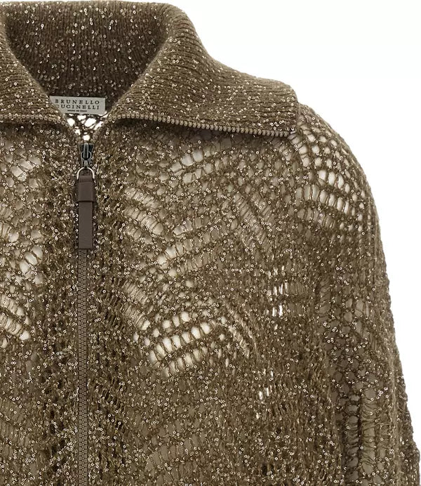 Close-up of a textured zip-up jacket featuring a metallic, snakeskin-like pattern in a bronze-gold color, with a visible &