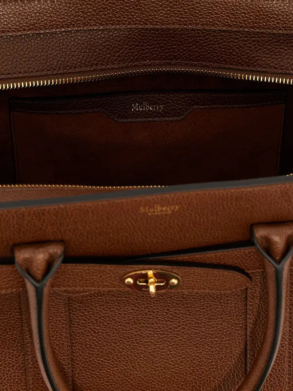 Close-up of a brown leather handbag with visible Mulberry branding.