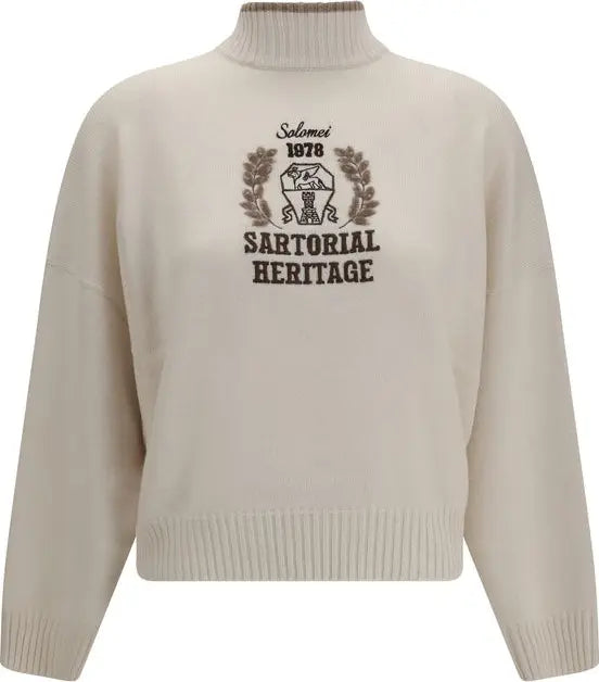An off-white knit mock-neck sweater with a dark brown graphic print on the chest reading &