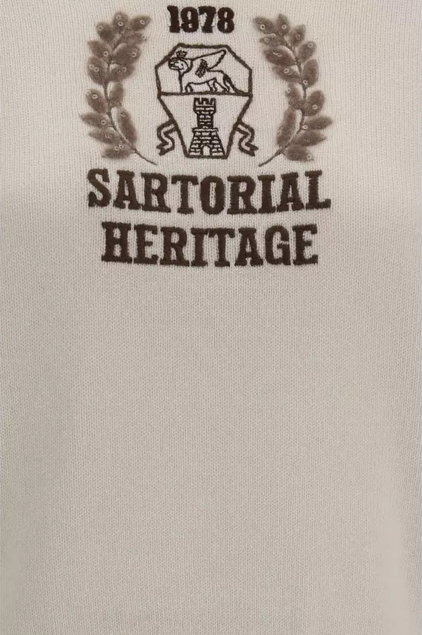 Close-up of a light beige fabric surface with a dark brown printed graphic reading &
