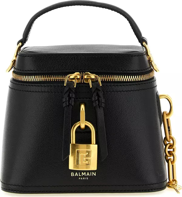 Black leather Balmain Paris top-handle handbag with gold-tone hardware, a front zip closure, a decorative padlock detail, and a gold chain strap on a white background.