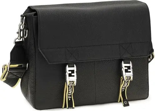 A black textured leather Fendi shoulder bag with two silver-tone Fendi FF logo buckles and gold-and-black branded straps hanging from the front, shown on a plain white background.