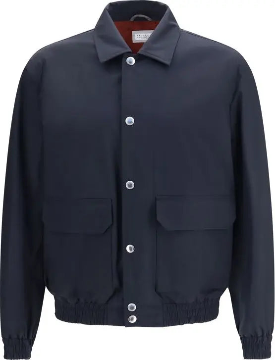 A dark navy blue jacket with a pointed collar, silver snap-button front, and two large front flap pockets, shown on a plain white background.