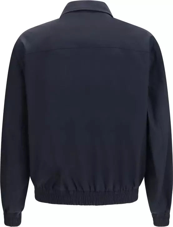 A dark navy blue jacket shown from the back, featuring a collar, long sleeves, and an elasticated hem, photographed against a plain white background.