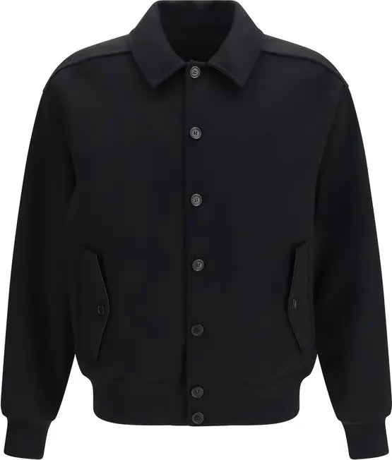 A black long-sleeve button-up jacket with a pointed collar, ribbed cuffs and hem, and two front flap pockets, shown on a plain white background.